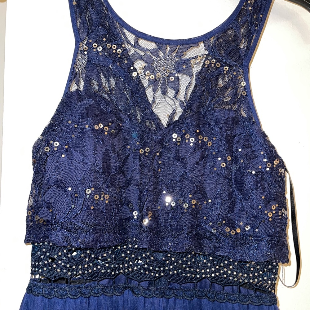 Long, almost ankle length royal blue dress.